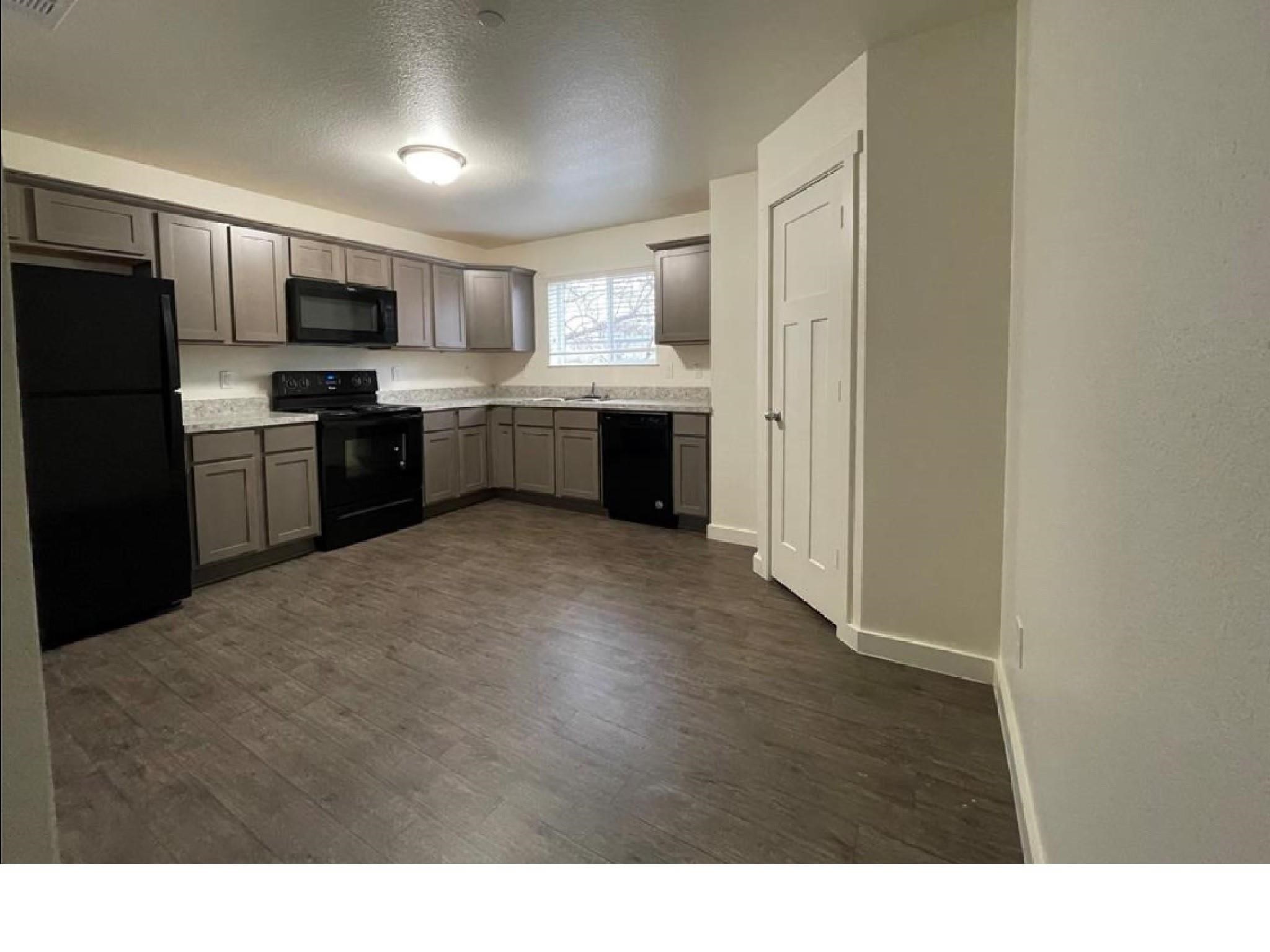 21155 Gosling Road, Unit 38C Spring, TX 77388 - Photo 4 of 21 a kitchen with refrigerator cabinets and stainless steel appliances