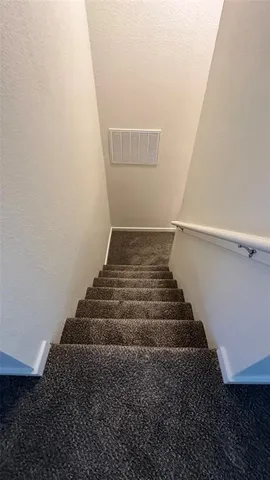 a view of a room that has a bed in it