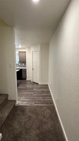 an empty room with closet and mirror