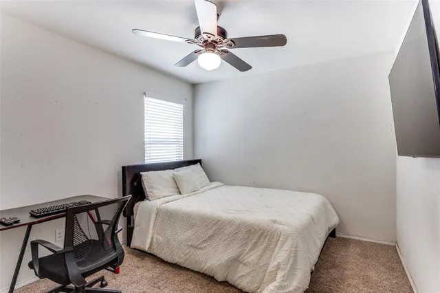 a bedroom with a bed window and a window