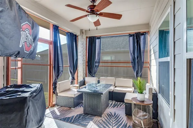 a view of a livingroom with furniture and a window