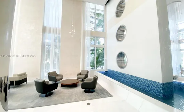 a living room with furniture and a window