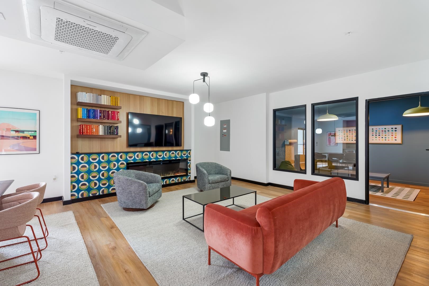 a living room with furniture and a flat screen tv