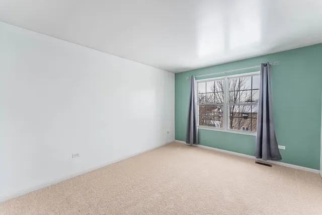 a view of a room with a refrigerator