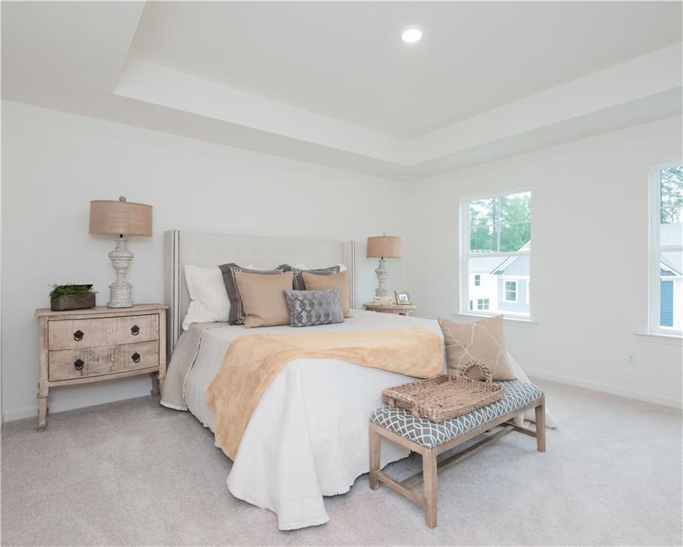 a bedroom with a bed and a couch