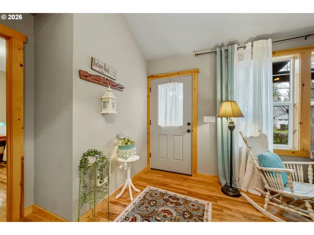 a balcony with furniture and a potted plant