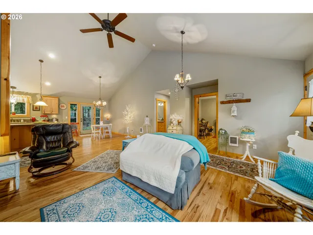 a living room with furniture and kitchen view