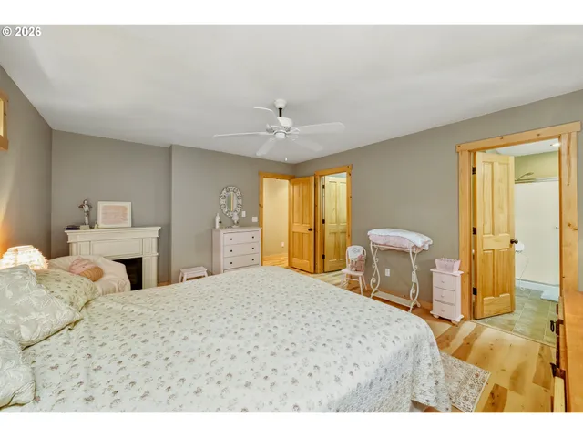 a bathroom with a double vanity sink toilet mirror and shower