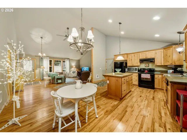 a kitchen with stainless steel appliances kitchen island granite countertop a sink and cabinets