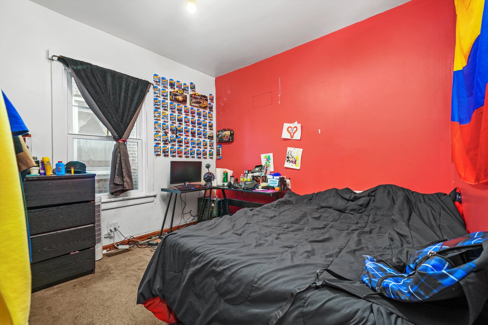 Undisclosed Address Chicago, IL 60641 - Photo 17 of 32 a bed sitting in a bedroom next to a window