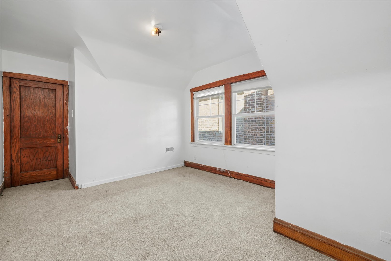 Undisclosed Address Chicago, IL 60641 - Photo 19 of 32 an empty room with windows