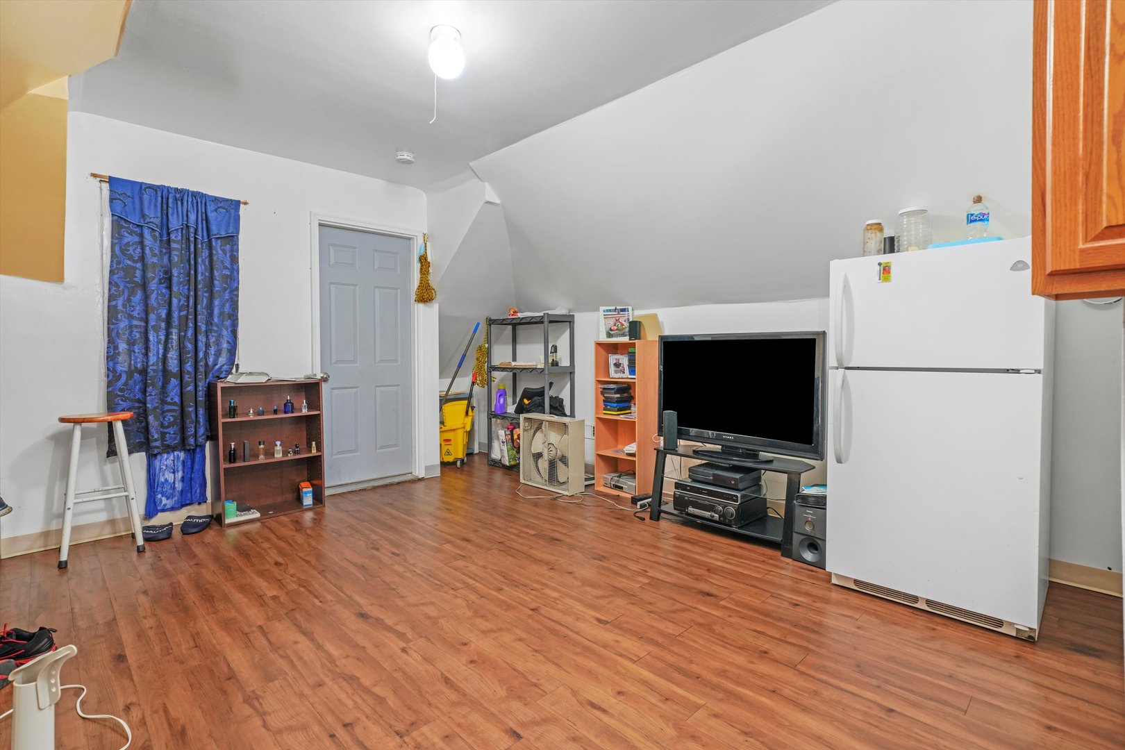 Undisclosed Address Chicago, IL 60641 - Photo 20 of 32 a view of a livingroom with furniture and a flat screen tv
