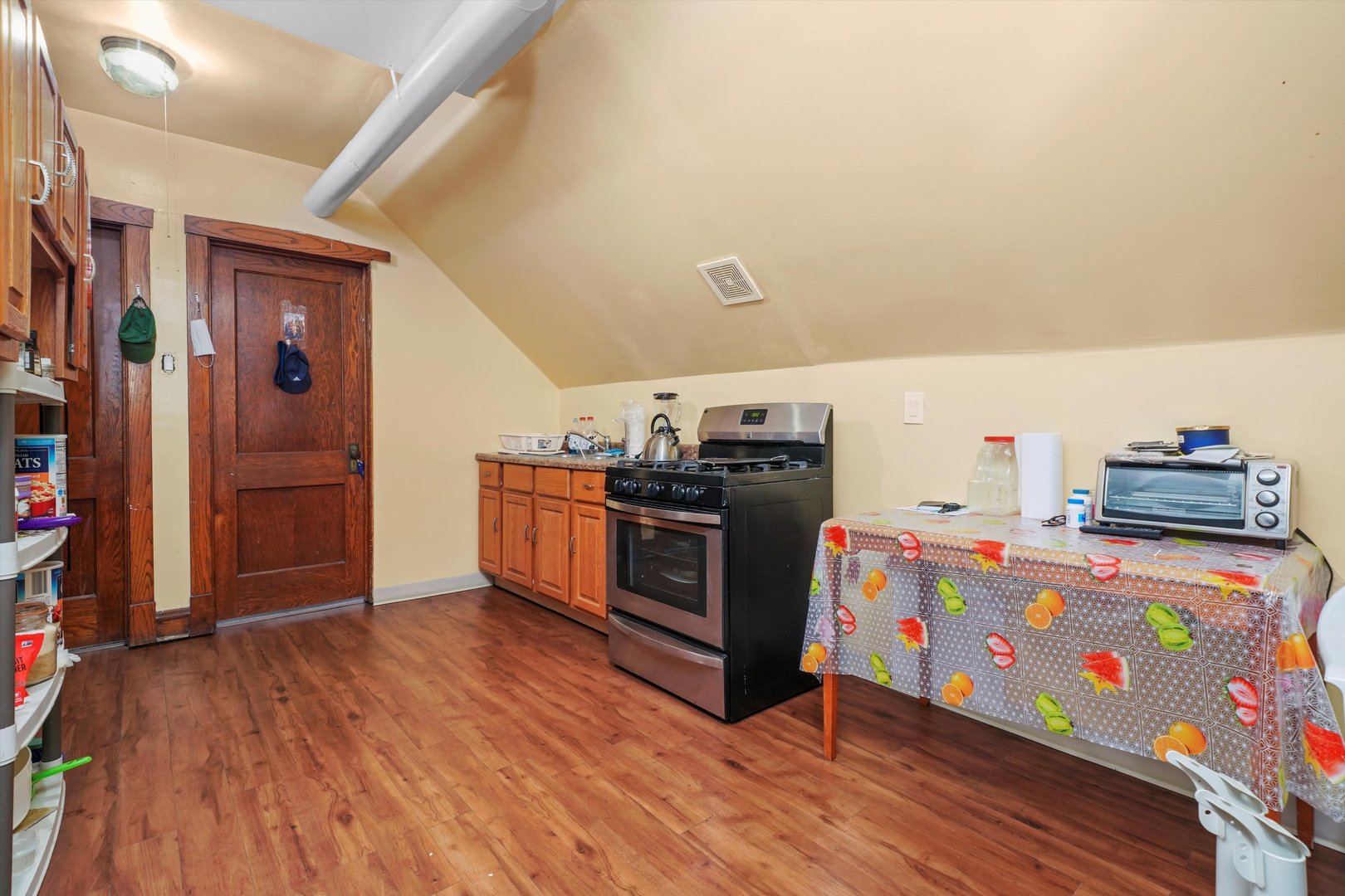 Undisclosed Address Chicago, IL 60641 - Photo 23 of 32 a kitchen with stainless steel appliances granite countertop a stove and a refrigerator