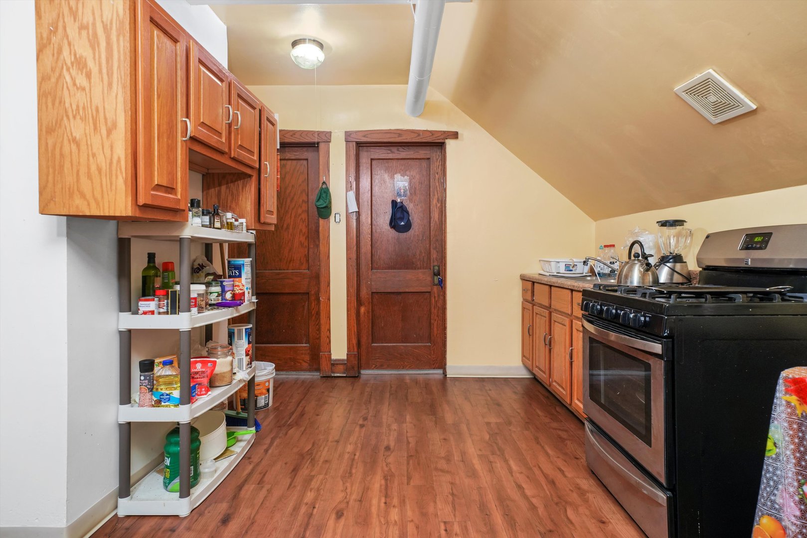 Undisclosed Address Chicago, IL 60641 - Photo 24 of 32 a kitchen with stainless steel appliances granite countertop a stove a sink and a refrigerator