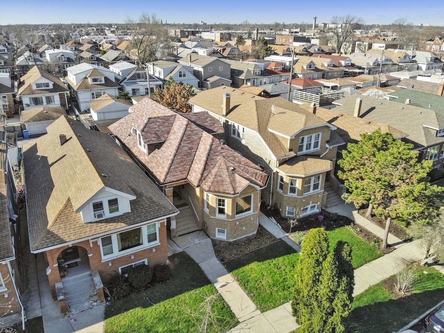 Undisclosed Address Chicago, IL 60641 - Photo 29 of 32 an aerial view of a residential apartment building with a yard
