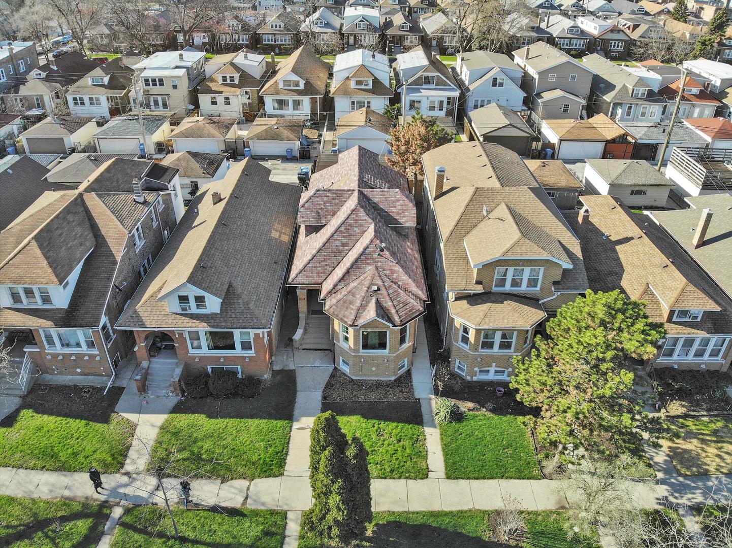 Undisclosed Address Chicago, IL 60641 - Photo 30 of 32 an aerial view of residential houses with yard