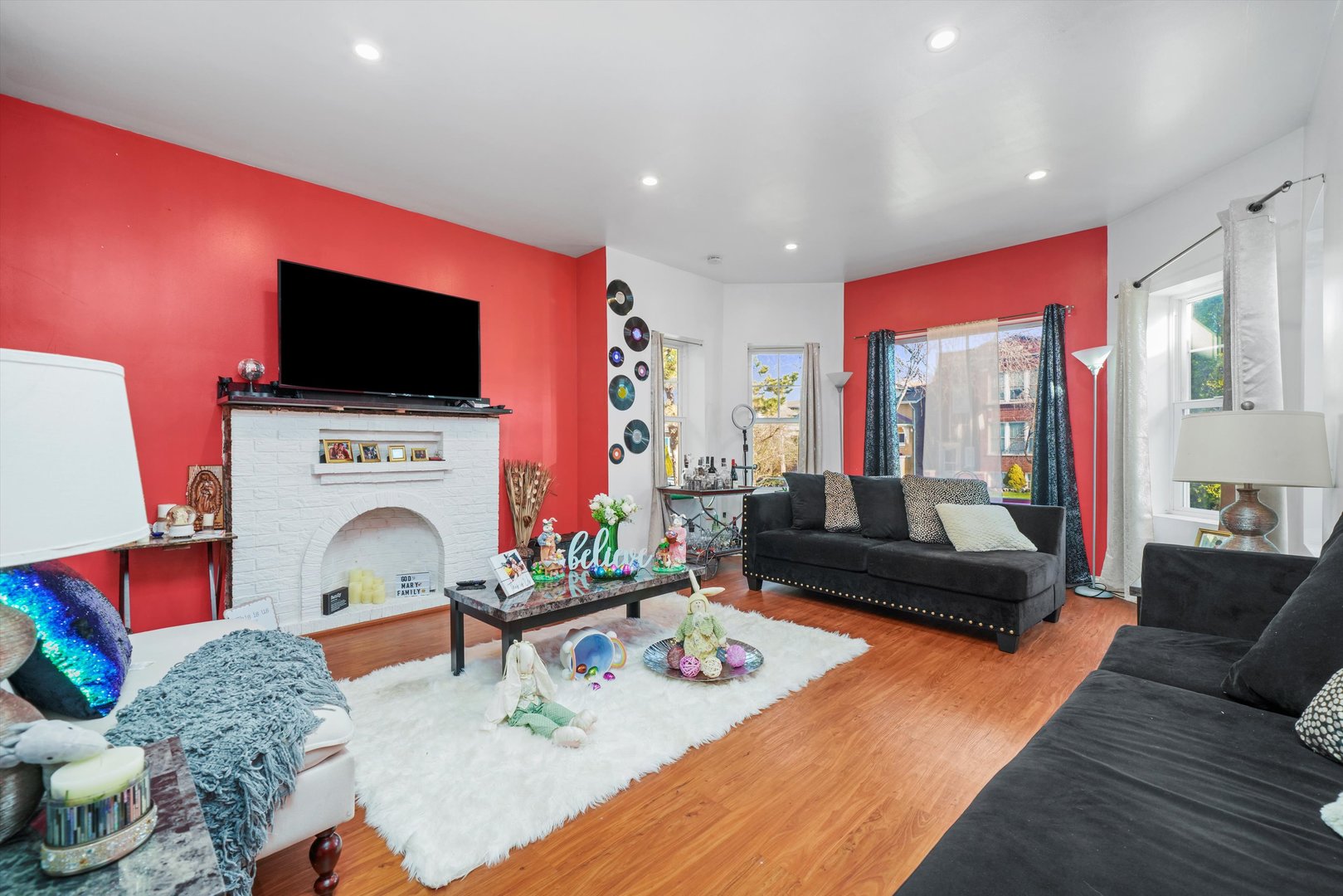 Undisclosed Address Chicago, IL 60641 - Photo 5 of 32 a living room with furniture and a flat screen tv