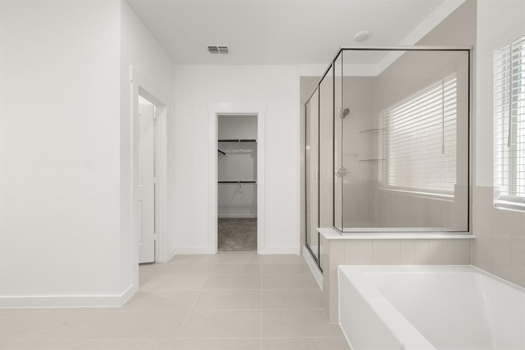 8709 Preakness Street Pilot Point, TX 76258 - Photo 13 of 24 22_6937 Freight Train- Primary Suite-3