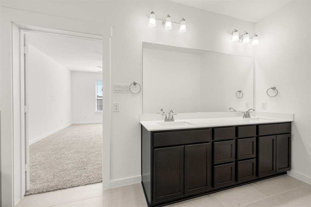 8709 Preakness Street Pilot Point, TX 76258 - Photo 14 of 24 23_6937 Freight Train- Primary Suite-4