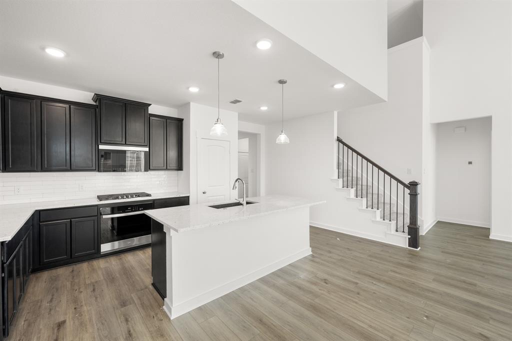 8709 Preakness Street Pilot Point, TX 76258 - Photo 6 of 24 15_6937 Freight Train- Kitchen-3