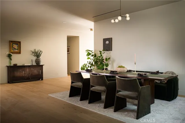 a view of walk in closet and wooden floor