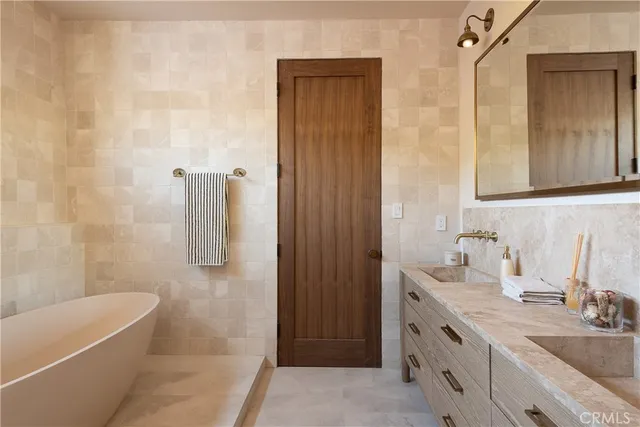 a bedroom with a bed and glass window