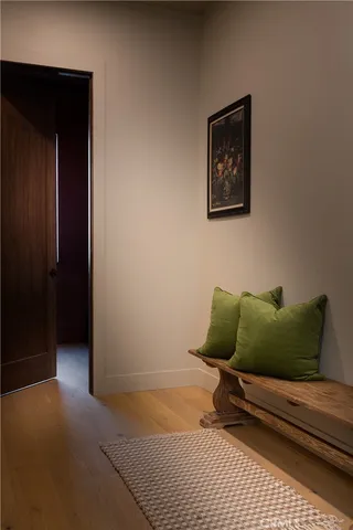 a wooden bench sitting in front of a building
