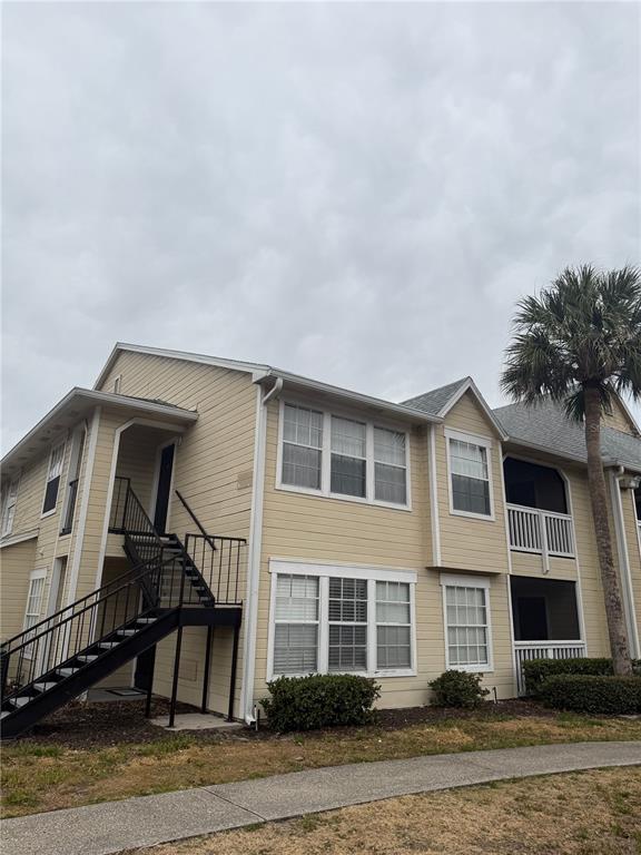 1049 South Hiawassee Road, Unit 3428 Orlando, FL 32835 - Photo 1 of 21 a front view of a house with a yard