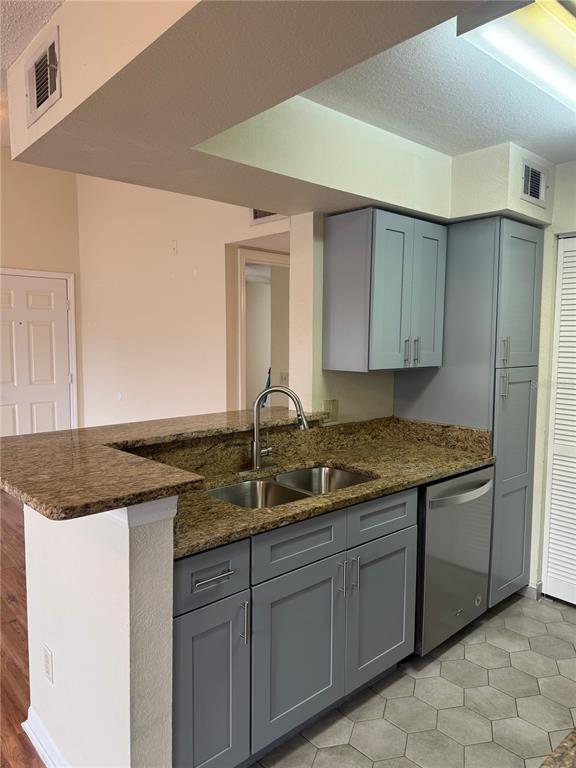 1049 South Hiawassee Road, Unit 3428 Orlando, FL 32835 - Photo 11 of 21 a kitchen with a sink and cabinets