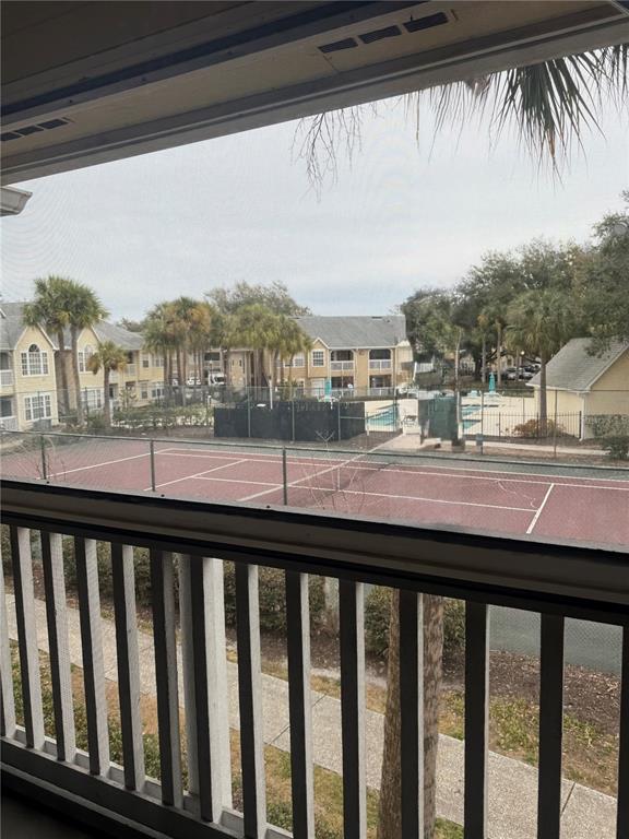 1049 South Hiawassee Road, Unit 3428 Orlando, FL 32835 - Photo 14 of 21 a view of a balcony with a yard and wooden fence