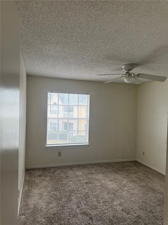 1049 South Hiawassee Road, Unit 3428 Orlando, FL 32835 - Photo 15 of 21 an empty room with a empty space and windows