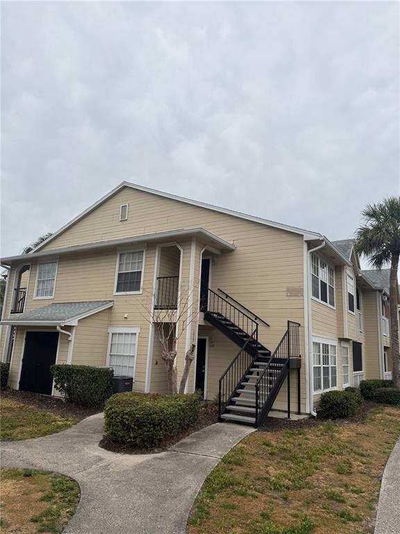 1049 South Hiawassee Road, Unit 3428 Orlando, FL 32835 - Photo 2 of 21 a front view of a house with garage