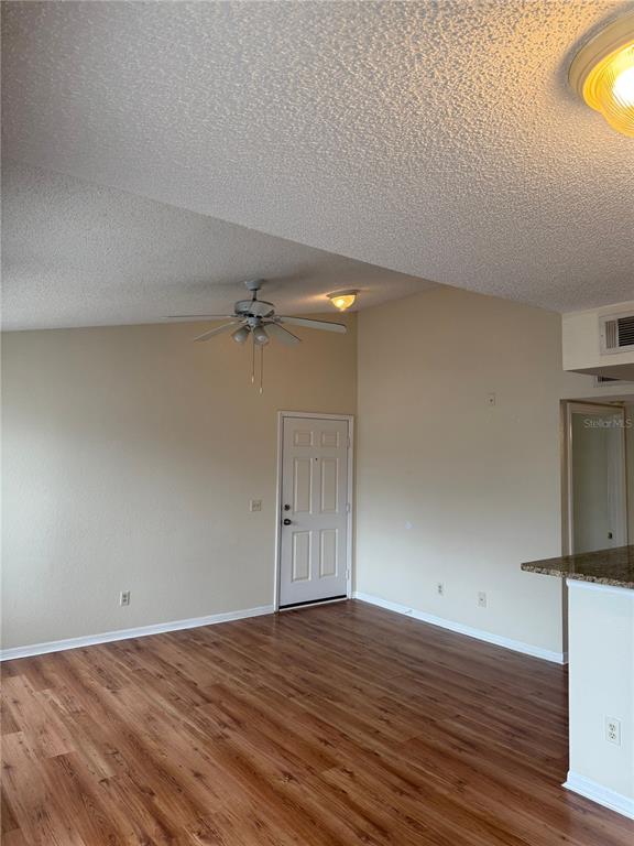 1049 South Hiawassee Road, Unit 3428 Orlando, FL 32835 - Photo 7 of 21 a view of empty room with wooden floor