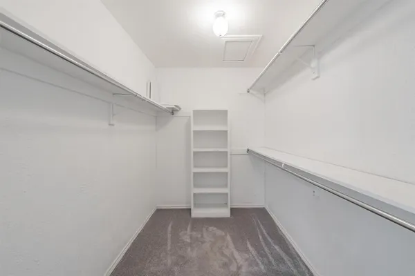 a view of an empty walk in closet