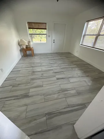 a view of an empty room and window