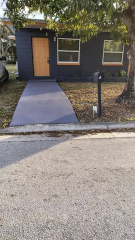 a view of a backyard of the house