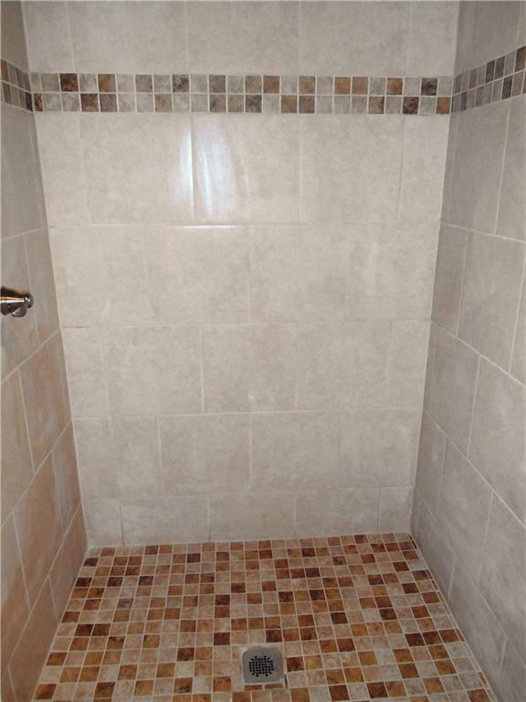 36 Simon Road Cheswick, PA 15024 - Photo 21 of 25 Larger than normal, custom tile shower is located in the bathroom on the lower level.
