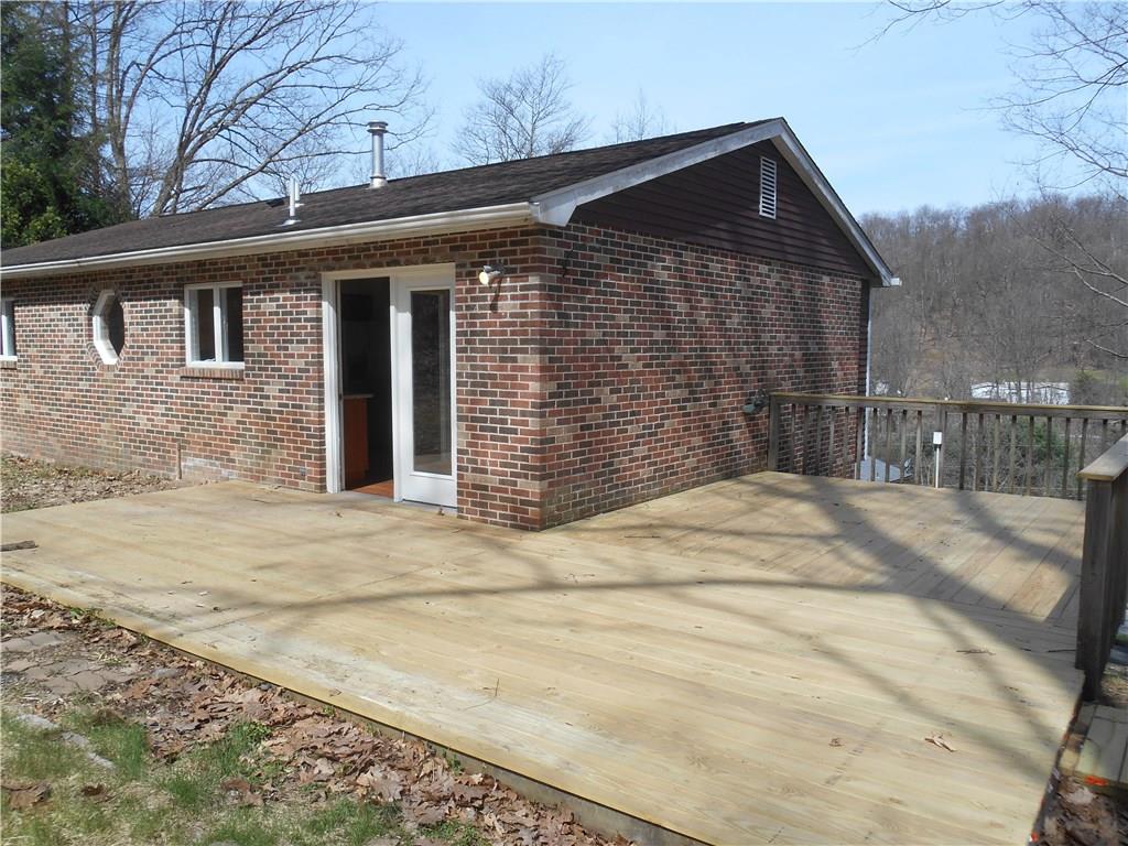 36 Simon Road Cheswick, PA 15024 - Photo 23 of 25 The deck wraps around from the dining room to make access extremely easy!! Space to grill, eat and sit and entertain!