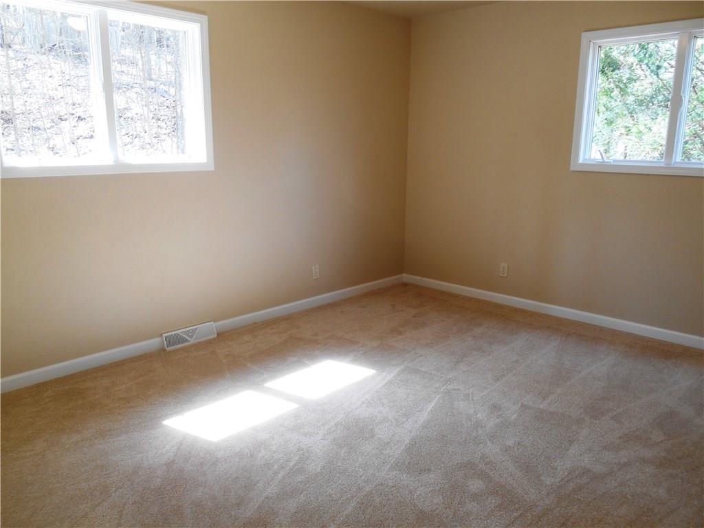 36 Simon Road Cheswick, PA 15024 - Photo 10 of 25 The master bedroom is 14x11. New carpet, paint and overhead lighting.