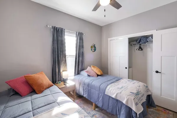 a bedroom with bed and a window