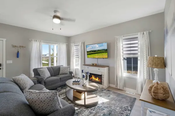 a living room with furniture and a fireplace