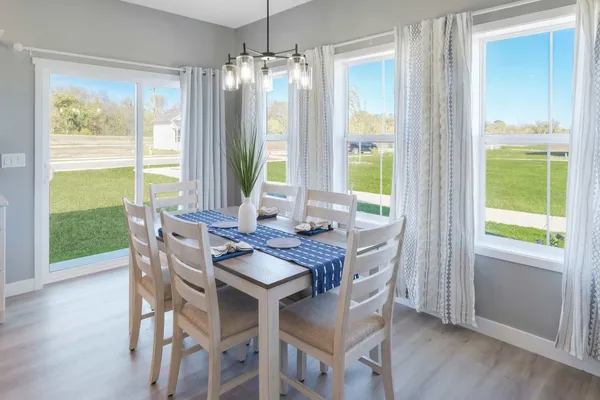 a dining room with furniture window wooden floor