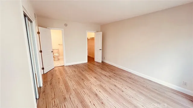 a view of hallway with wooden floor