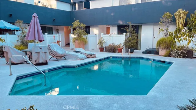 a view of living room with furniture and a fireplace