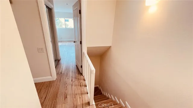 a view of a bathroom from a corridor