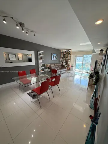 a living room with furniture and white walls