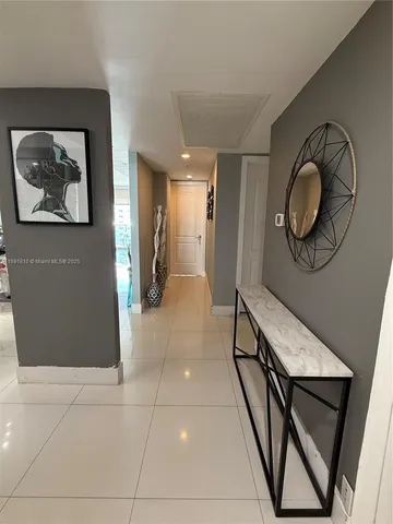 a view of hallway with furniture