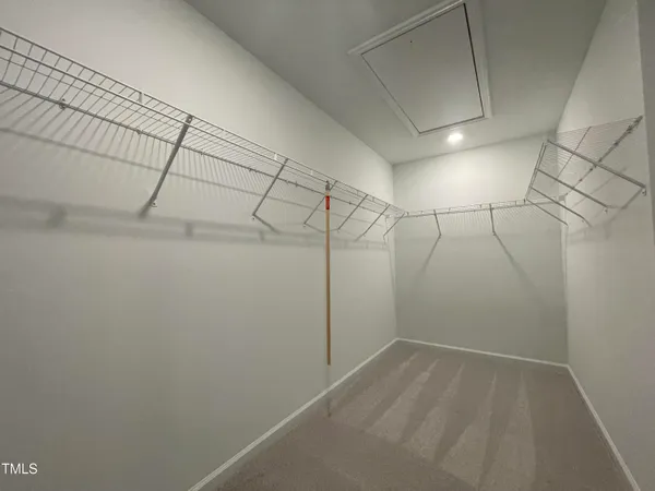 a view of a room with racks on the wall