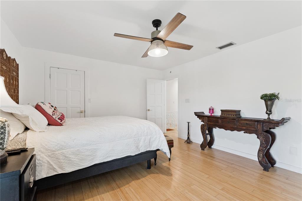 7621 Orange Tree Lane Orlando, FL 32819 - Photo 21 of 47 a bedroom with a bed desk and a window