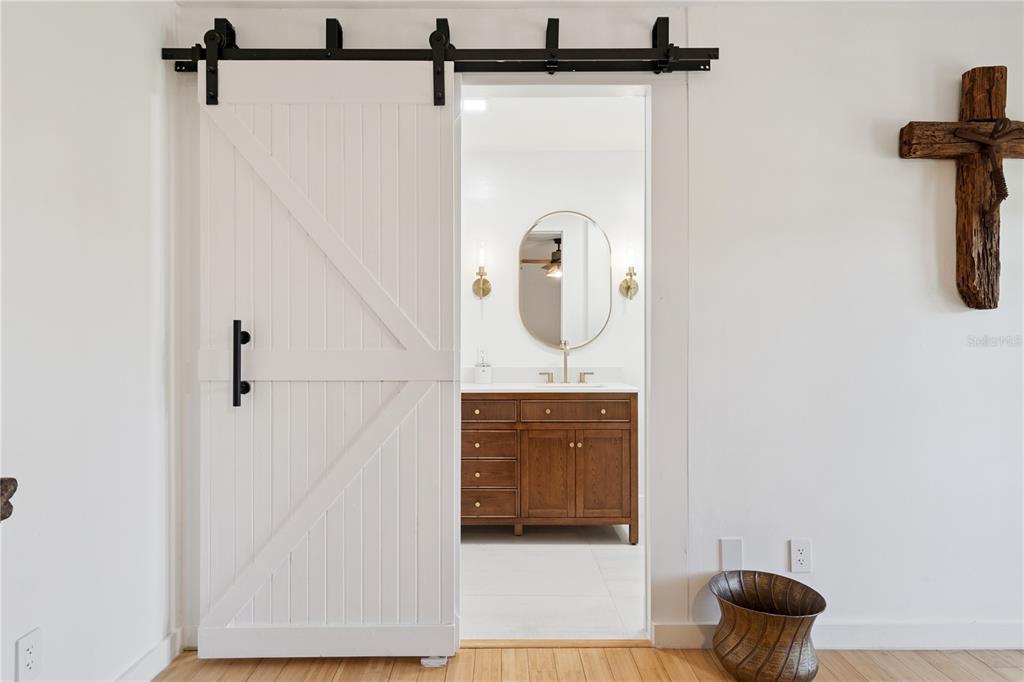 7621 Orange Tree Lane Orlando, FL 32819 - Photo 22 of 47 a bathroom with a shower and a mirror